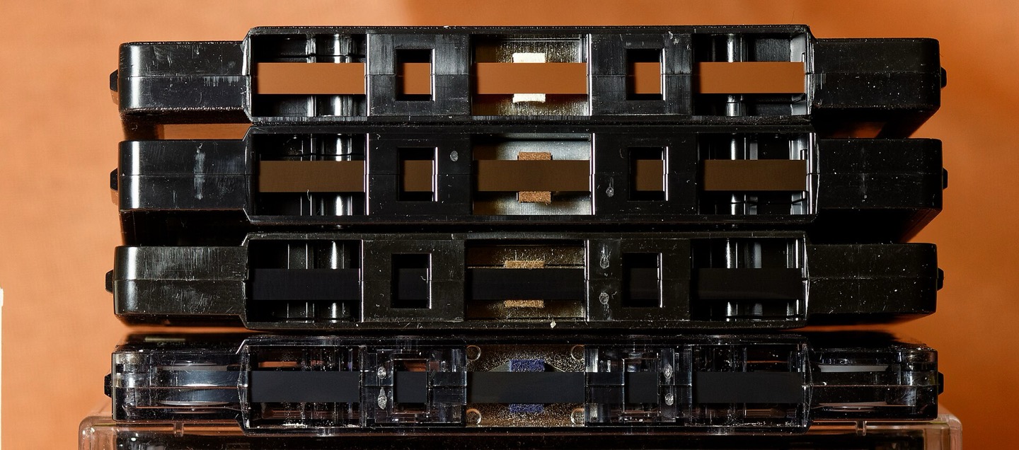 Four cassette tape formulations shown side by side