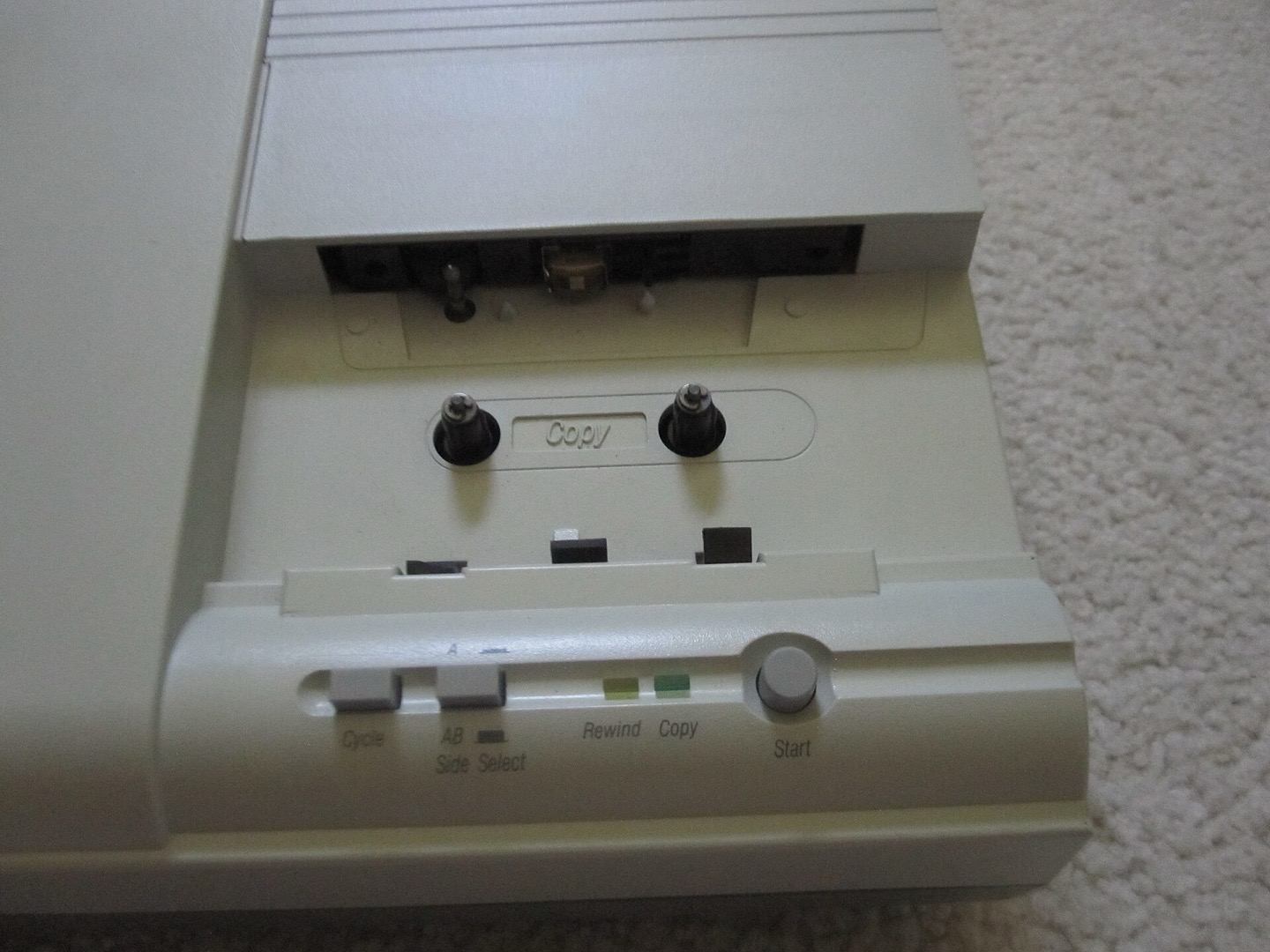 Open cassette duplicator transport viewed from the copy side